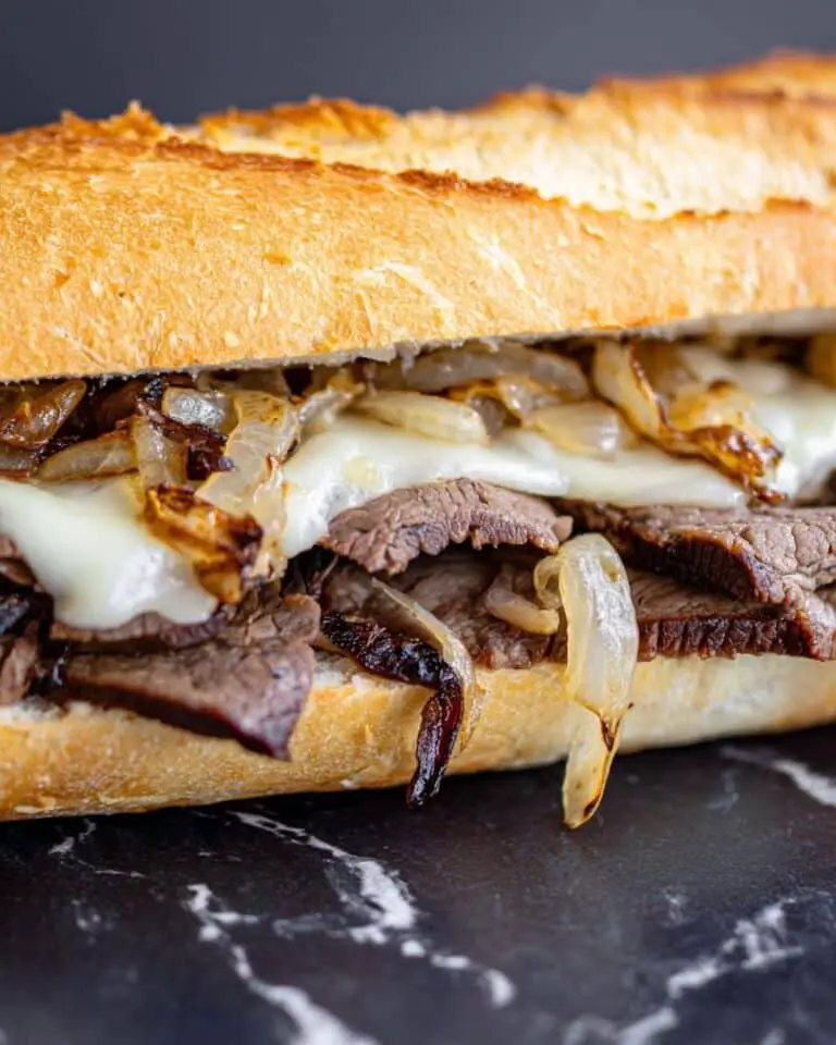 Herb Butter Steak Sandwich with Caramelized Onions and Melted Havarti Recipe