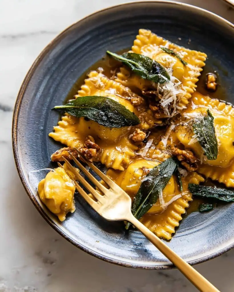 Sage Butter Pumpkin Cheese Ravioli with Crispy Sage and Manchego Recipe