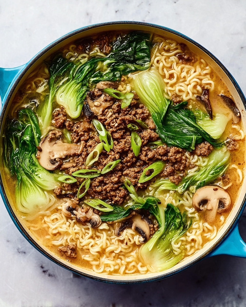 A blue pot filled with ramen soup sits on a white marbled surface. The soup has light brown broth with a slightly oily texture. Inside, there are three sections of curly, pale yellow noodles. Green leafy bok choy is placed in three locations, showing fresh bright green leaves and light green stalks. Brown cooked ground meat is spread evenly on top across the soup. Thin beige slices of mushrooms float among the noodles and meat. The whole dish looks rich and colorful with a mix of textures. Photo taken with an iphone --ar 4:5 --v 7