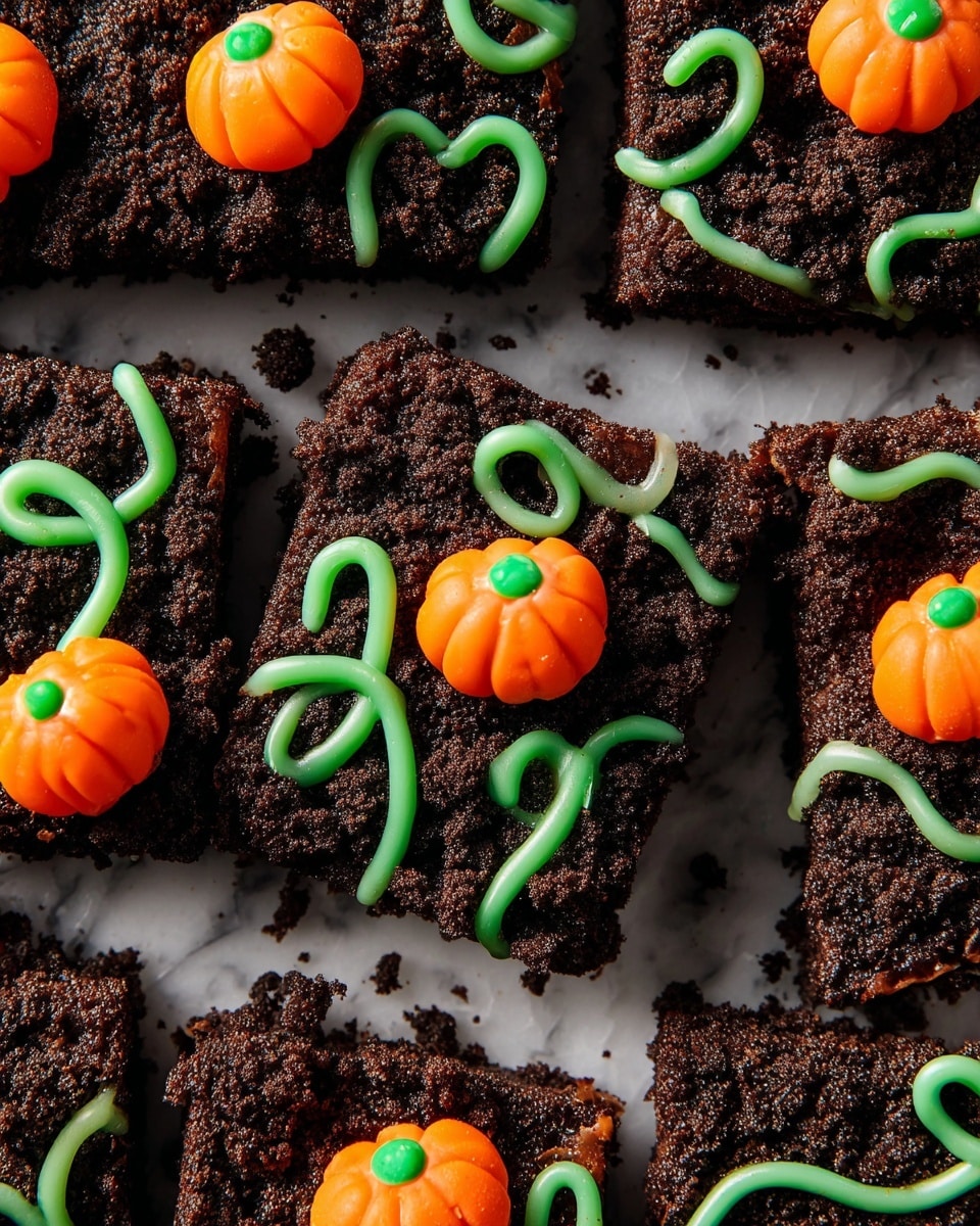 The image shows several square pieces of dark brown layered brownies with a crumbly textured top layer that looks like crushed cookies. Each piece is decorated with small three-dimensional bright orange pumpkin-shaped candies placed on top and connected with thin, curly green icing vines that twist and loop across the surface. The brownies are arranged on a white marbled surface and are displayed closely together without any plate. The decorations give a festive fall or Halloween feel. Photo taken with an iphone --ar 4:5 --v 7