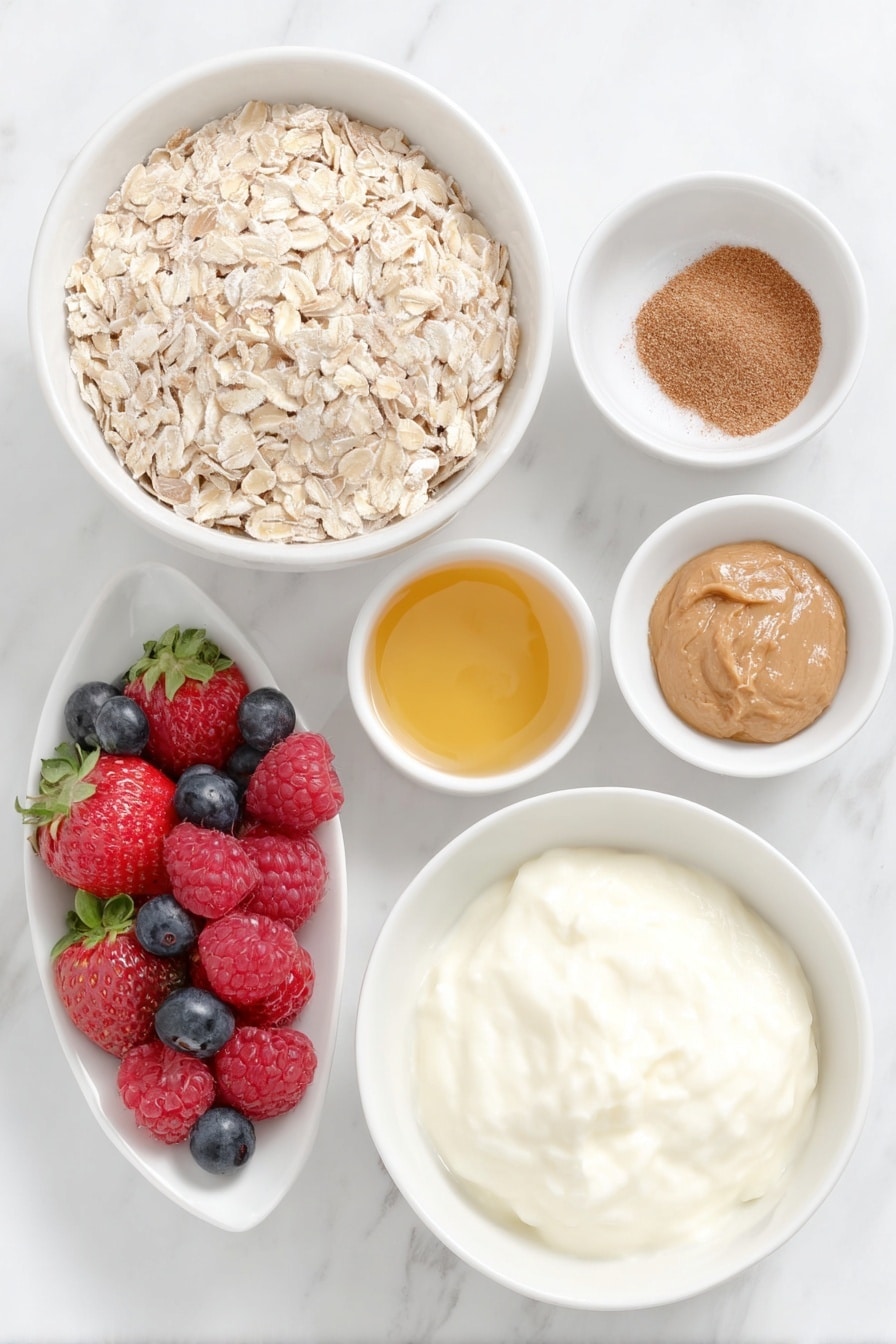Flat lay of a small white ceramic bowl of rolled oats, a small white ceramic bowl of ground cinnamon powder, a dollop of smooth almond butter on a white ceramic plate, a small white ceramic bowl filled with golden honey, a small white ceramic bowl containing clear vanilla extract, a large white ceramic bowl of creamy Greek yogurt, and a handful of fresh mixed berries including strawberries, blueberries, and raspberries, all arranged in perfect symmetry and balanced proportions, placed on a clean white marble surface, soft natural light, photo taken with an iPhone, professional food photography style, fresh ingredients, white ceramic bowls, no bottles, no duplicates, no utensils, no packaging --ar 2:3 --v 7 --p m7354615311229779997 - Frozen Yogurt Granola Cups, healthy frozen yogurt snacks, easy breakfast ideas, no-bake dessert recipes, kid-friendly snack treats