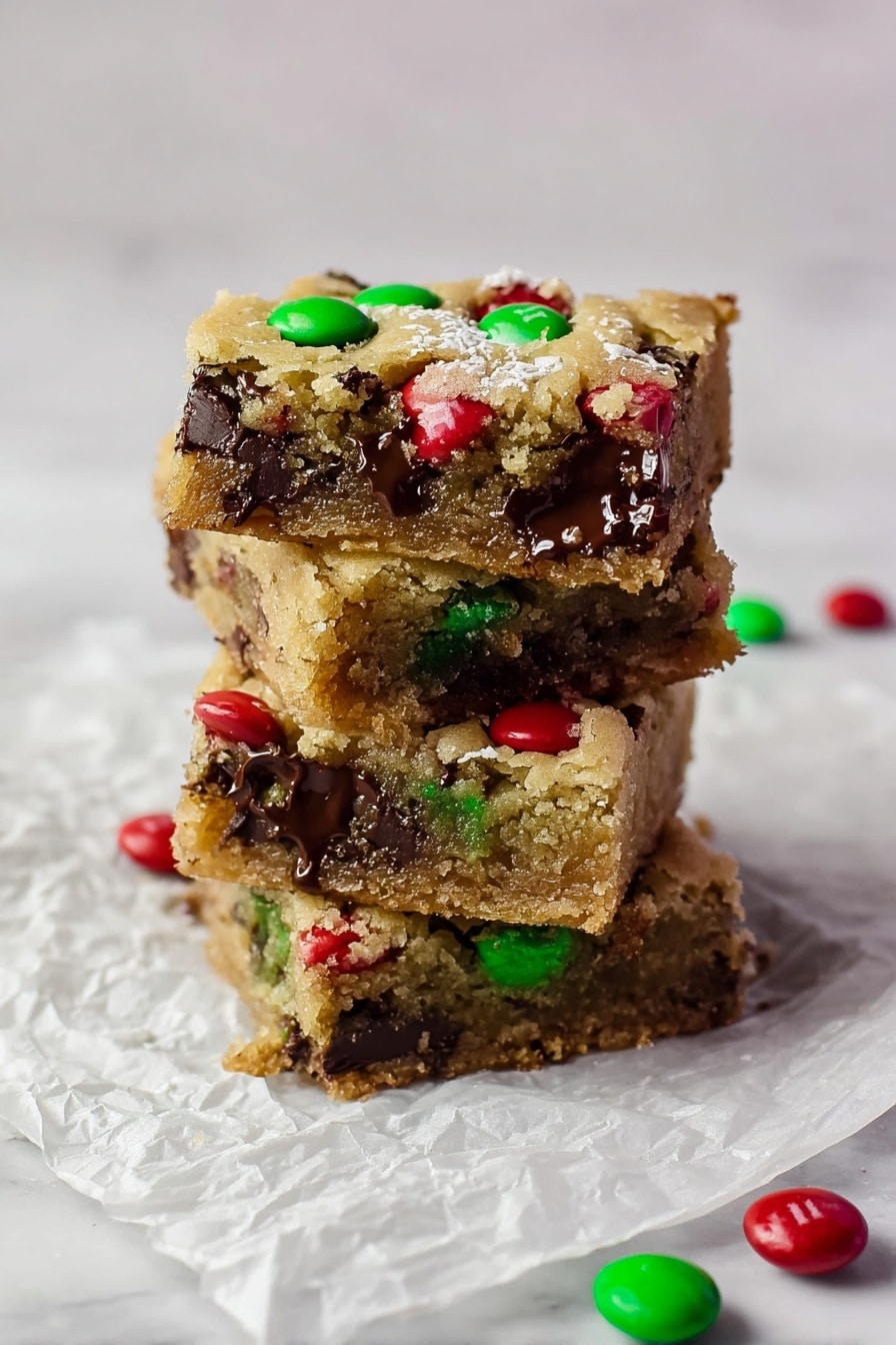 A square cookie bar with one layer is shown, its golden brown surface dotted with red and green candy pieces and small chocolate chips scattered evenly. The cookie bar is cut into diamond-shaped pieces arranged neatly on a sheet of crinkled white paper, placed on a white marbled surface. Around the cookie bar, there are scattered red and green candy pieces as well as Christmas tree ornaments in red, green, and silver, creating a festive look. A small glass bowl filled with coarse white salt is visible on the right side. The scene is bright and clear, capturing the texture of the cookie bar and the shiny reflection of the ornaments. photo taken with an iphone --ar 2:3 --v 7 - Chewy Browned Butter Blondies, Browned Butter Blondies recipe, easy blondies with browned butter, chewy blondie bars, festive blondie dessert