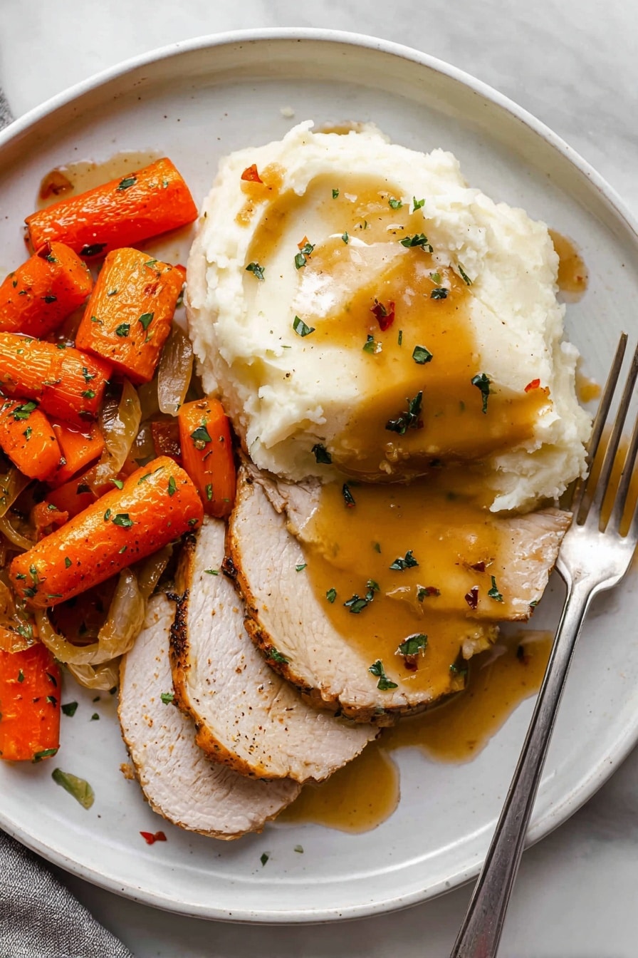 The image shows a white plate with three layers of sliced light brown cooked meat on the top right, covered with a smooth, shiny golden brown sauce and small green herb pieces sprinkled on top. On the left side of the plate is a thick, creamy pile of mashed white potatoes with some of the golden sauce spilling onto it. At the bottom left of the plate, there are roasted carrot pieces in bright orange color mixed with light golden caramelized onions, all garnished with green herbs. A silver fork with some sauce on it is placed on the right edge of the plate, resting on the white marbled surface. photo taken with an iphone --ar 2:3 --v 7 - Slow Cooker Herb Turkey Breast, turkey breast recipe, easy turkey dinner, juicy turkey breast, flavorful turkey dinner