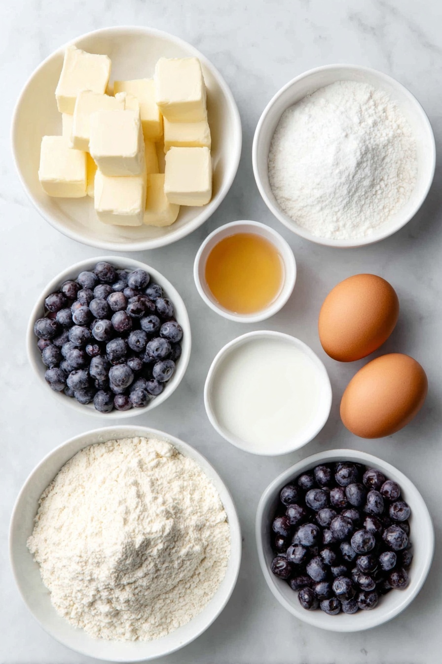 Flat lay of cold unsalted butter cut into small chunks on a white ceramic plate, a small mound of all-purpose flour in a white ceramic bowl, a small white bowl filled with granulated sugar, a few teaspoons of baking powder and baking soda displayed as white powder neatly spooned into two separate small white bowls, fine sea salt granules in a tiny white ceramic dish, a handful of fresh plump blueberries arranged on a small white plate, a white ceramic bowl with cold buttermilk, a couple of whole unshelled clean brown eggs, a small white bowl with golden honey, all set symmetrically and proportionally placed on a clean white marble surface, soft natural light, photo taken with an iPhone, professional food photography style, fresh ingredients, white ceramic bowls, no bottles, no duplicates, no utensils, no packaging --ar 2:3 --v 7 --p m7354615311229779997 - Blueberry Biscuits with Honey Butter, blueberry biscuit recipe, homemade blueberry biscuits, breakfast blueberry biscuits, flaky blueberry biscuits