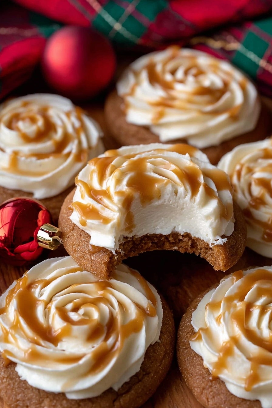 The image shows several round cookies with a light brown base that looks soft and slightly textured. Each cookie has one layer of white cream swirled on top in a rose-like pattern, with a smooth and fluffy texture. Over the cream, there is a drizzle of golden caramel sauce, adding a shiny, sticky layer with some droplets running down. The cookies are placed on a wooden surface, surrounded by a small white bowl filled with coarse brown sugar, a red Christmas ornament, and some green and red ribbons, all set against a white marbled background. photo taken with an iphone --ar 2:3 --v 7 - Toffee Date Cookies with Creamy Frosting, decadent date cookie recipe, easy toffee dessert, soft chewy cookies with frosting, holiday cookie ideas