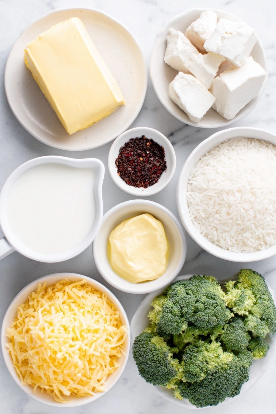 Flat lay of unsalted butter in a small white ceramic bowl, finely diced yellow onion on a simple white ceramic plate, three whole uncracked garlic cloves beside a small white bowl of dijon mustard, freshly ground black pepper and white peppercorns arranged neatly, a small white bowl filled with whole milk, cream cheese cut into cubes on a plain white ceramic dish, a modest pile of shredded extra sharp cheddar cheese, a small mound of grated parmesan cheese on a white ceramic plate, uncooked long grain white rice in a small white bowl, fresh broccoli florets diced into small pieces on a white ceramic plate, shredded carrots forming a neat pile on plain white ceramic, all ingredients perfectly balanced and symmetrically arranged placed on a clean white marble surface, soft natural light, photo taken with an iPhone, professional food photography style, fresh ingredients, white ceramic bowls, no bottles, no duplicates, no utensils, no packaging --ar 2:3 --v 7 --p m7354615311229779997 - Cheesy Broccoli Rice Casserole, Broccoli and Rice Bake, Vegetarian Cheesy Casserole, Easy Broccoli Rice Dish, creamy broccoli casserole