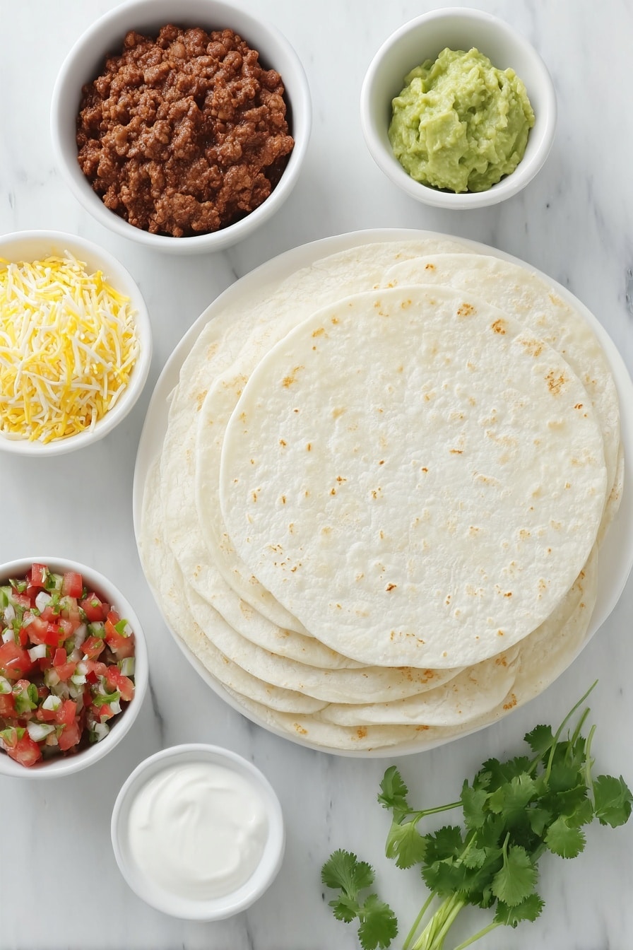 Flat lay of ten fresh, unbroken flour tortillas stacked neatly next to a small white ceramic bowl filled with seasoned cooked ground beef mixed with smooth refried beans, a small mound of shredded Mexican style cheese with a mix of yellow and white strands, a small white bowl of bright green guacamole, a small white bowl of creamy white sour cream, a small white bowl of vibrant pico de gallo with diced tomatoes, onions, and cilantro leaves, and a few fresh sprigs of bright green cilantro placed loosely beside the bowls, all arranged symmetrically on a simple white ceramic plate, placed on a clean white marble surface, soft natural light, photo taken with an iPhone, professional food photography style, fresh ingredients, white ceramic bowls, no bottles, no duplicates, no utensils, no packaging --ar 2:3 --v 7 --p m7354615311229779997 - Beef and Bean Sheet Pan Quesadilla, easy beef quesadilla, crowd-pleasing sheet pan dinner, cheesy beef quesadilla, quick sheet pan recipes
